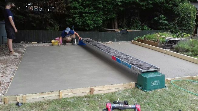 Members of our teaming laying concert foundations for a customer project.